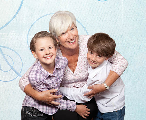 Grandmother hugging grandkids