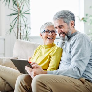 senior couple on tablet