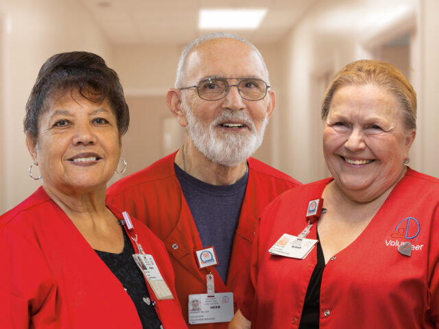 photo of three hospital volunteers