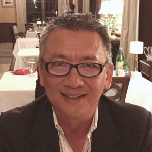 photo of asian man wearing dark rimmed glasses