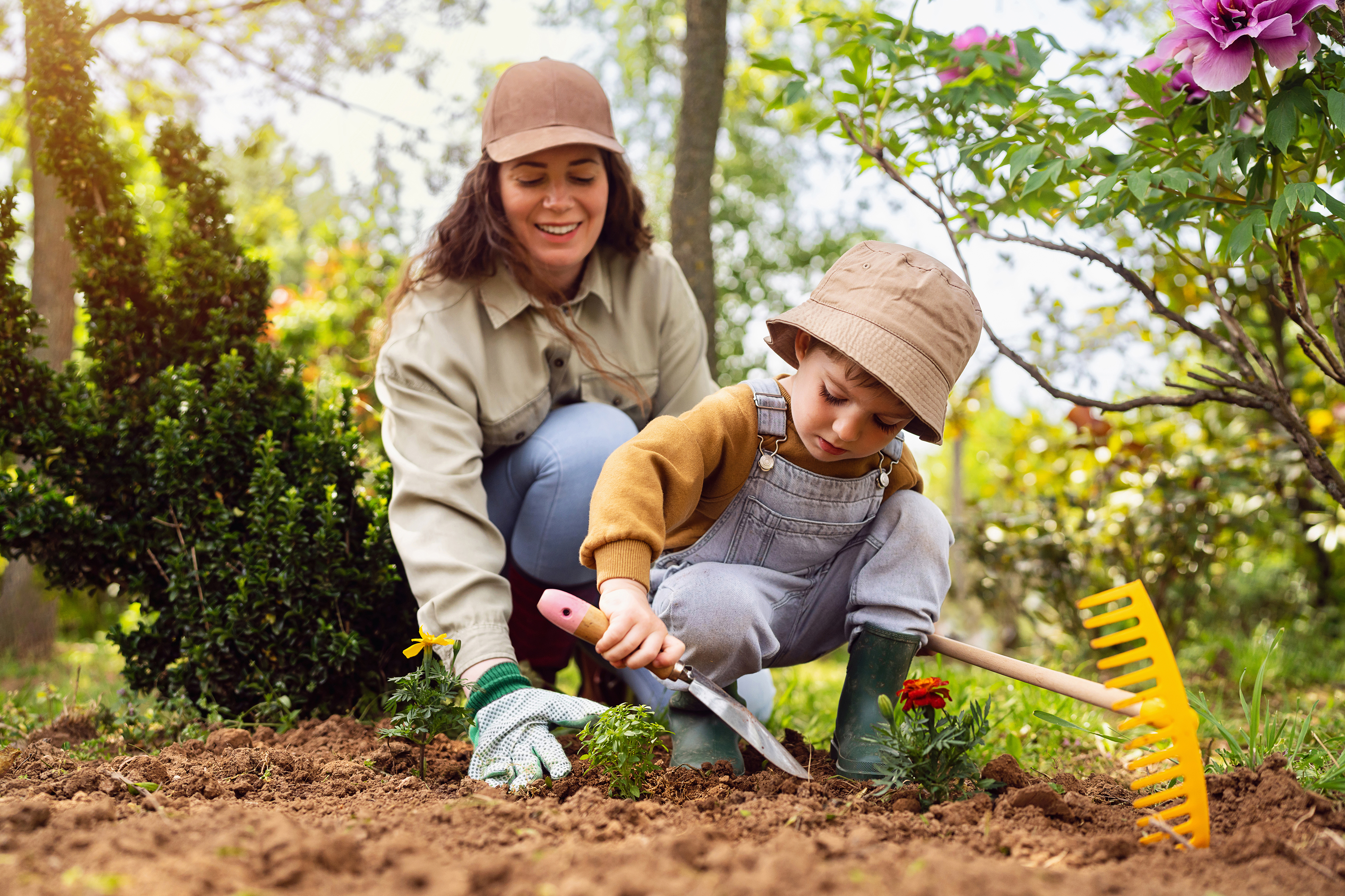 Mother and son gardening together